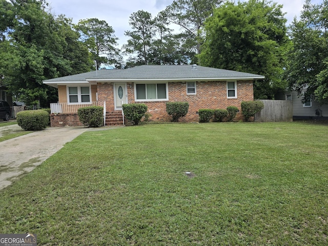 4322 Summerhill Dr, Macon, GA 31204 - view of front of house featuring brick siding, concrete driveway, and roof with shingles