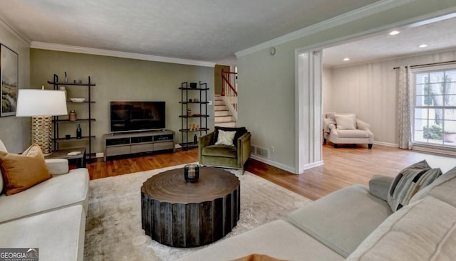 595 Glenforest Rd, Sandy Springs, GA 30328 - living area featuring wood finished floors, stairs, crown molding, and recessed lighting