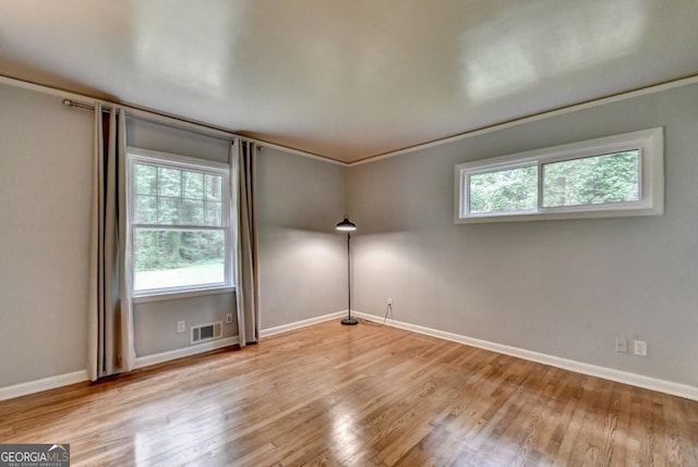 595 Glenforest Rd, Sandy Springs, GA 30328 - unfurnished room with plenty of natural light and wood finished floors