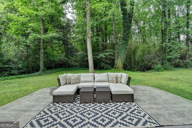 595 Glenforest Rd, Sandy Springs, GA 30328 - view of patio featuring an outdoor hangout area and a wooded view