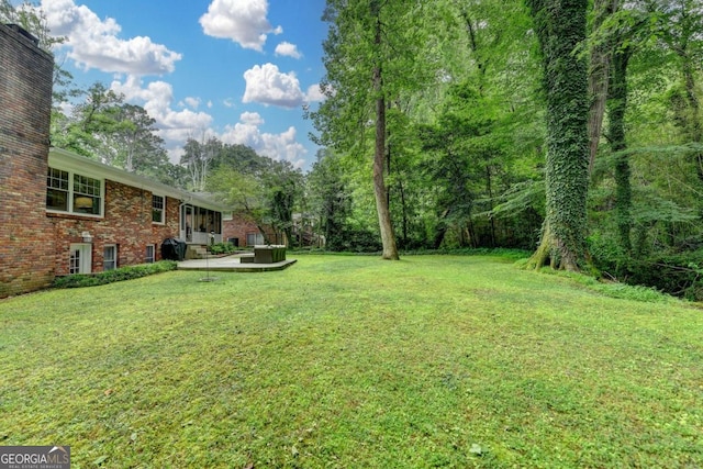 595 Glenforest Rd, Sandy Springs, GA 30328 - view of grassy yard with a patio