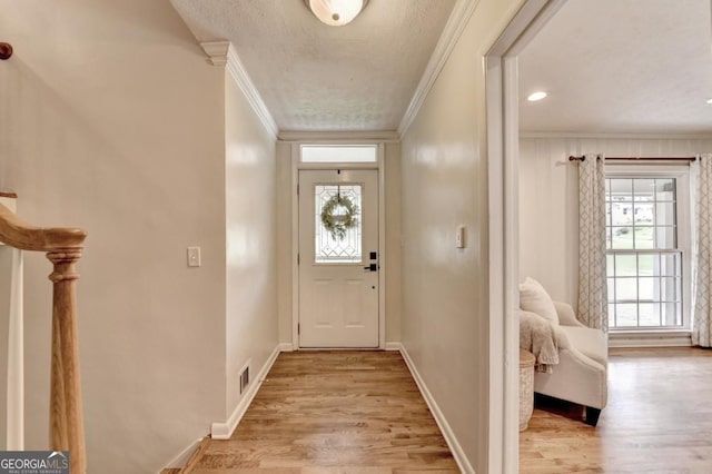 595 Glenforest Rd, Sandy Springs, GA 30328 - entryway with crown molding and light wood-style flooring