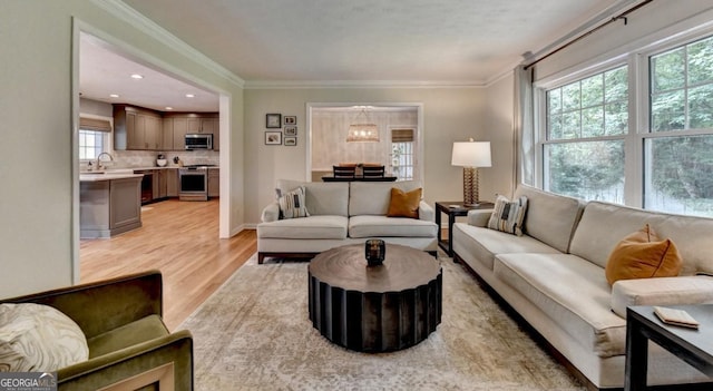 595 Glenforest Rd, Sandy Springs, GA 30328 - living room with light wood finished floors, healthy amount of natural light, ornamental molding, and recessed lighting