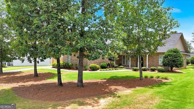 6 Majestic Oaks Way NE, Rome, GA 30165 - obstructed view of property with a front yard, brick siding, roof with shingles, and driveway