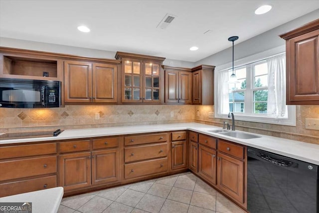 6 Majestic Oaks Way NE, Rome, GA 30165 - kitchen with black appliances, brown cabinets, light tile patterned floors, decorative light fixtures, and recessed lighting