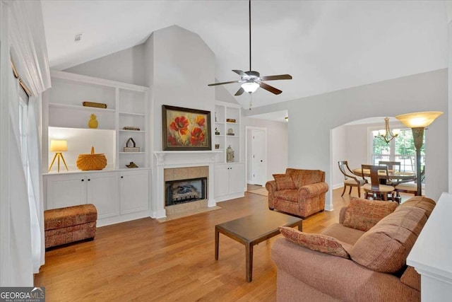 6 Majestic Oaks Way NE, Rome, GA 30165 - living area featuring light wood-type flooring, a chandelier, ceiling fan, a fireplace, and built in features