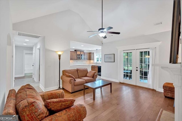 6 Majestic Oaks Way NE, Rome, GA 30165 - living area with french doors, ceiling fan, light wood finished floors, and high vaulted ceiling