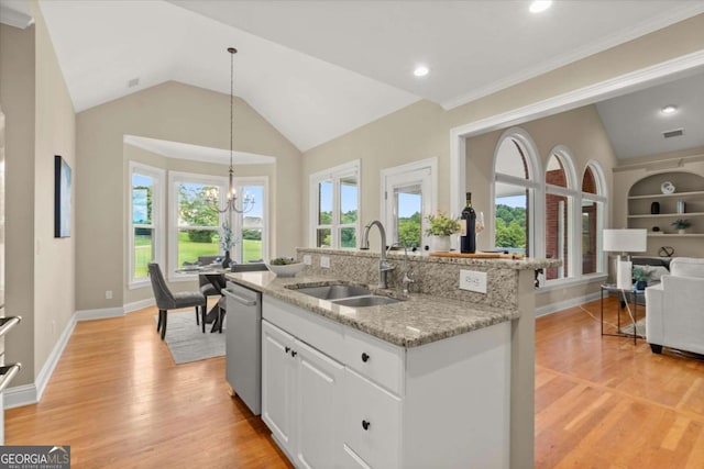 411 Hickory Fairway Ct, Woodstock, GA 30188 - kitchen with stainless steel dishwasher, light wood finished floors, a kitchen island with sink, white cabinets, and light stone countertops