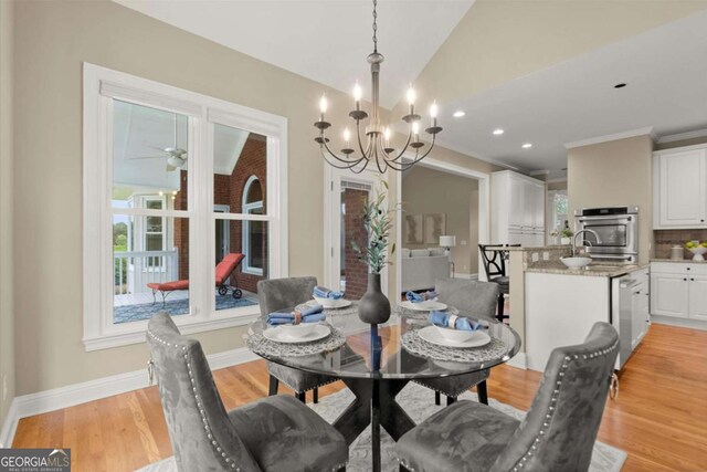 411 Hickory Fairway Ct, Woodstock, GA 30188 - dining room with a chandelier, light wood finished floors, vaulted ceiling, recessed lighting, and ornamental molding