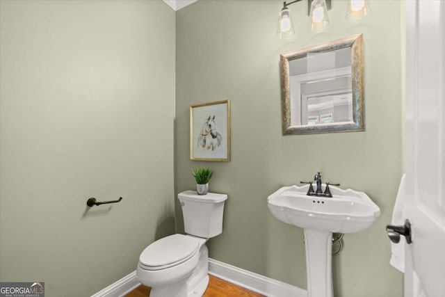 411 Hickory Fairway Ct, Woodstock, GA 30188 - half bathroom featuring toilet and wood finished floors