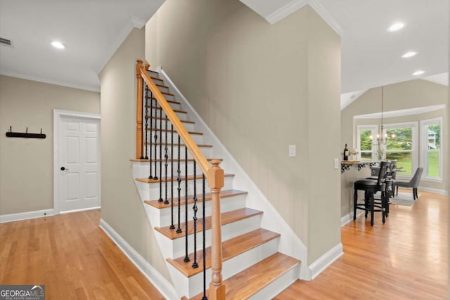 411 Hickory Fairway Ct, Woodstock, GA 30188 - staircase featuring wood finished floors, recessed lighting, a chandelier, and crown molding