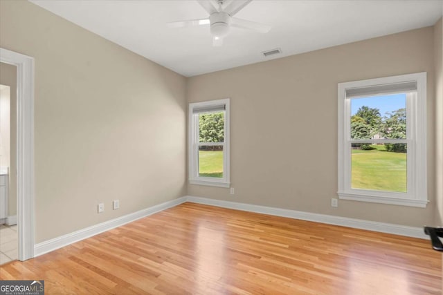 411 Hickory Fairway Ct, Woodstock, GA 30188 - empty room featuring light wood-style floors and ceiling fan