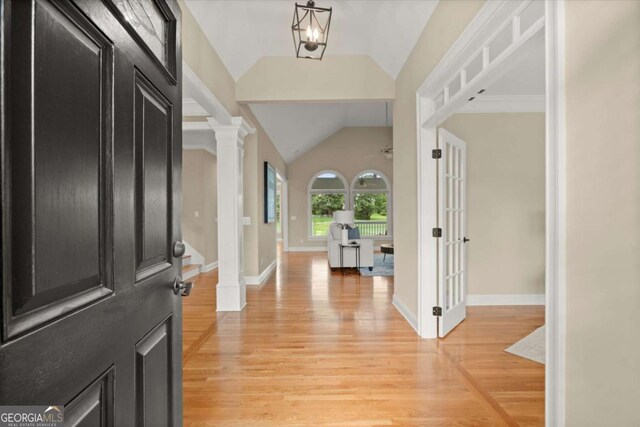 411 Hickory Fairway Ct, Woodstock, GA 30188 - entryway featuring vaulted ceiling, light wood-type flooring, and ornate columns