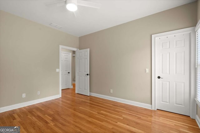 411 Hickory Fairway Ct, Woodstock, GA 30188 - unfurnished bedroom featuring light wood finished floors and a ceiling fan