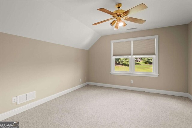 411 Hickory Fairway Ct, Woodstock, GA 30188 - additional living space with light colored carpet, vaulted ceiling, and ceiling fan