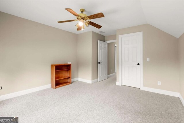 411 Hickory Fairway Ct, Woodstock, GA 30188 - additional living space with ceiling fan, light colored carpet, and vaulted ceiling