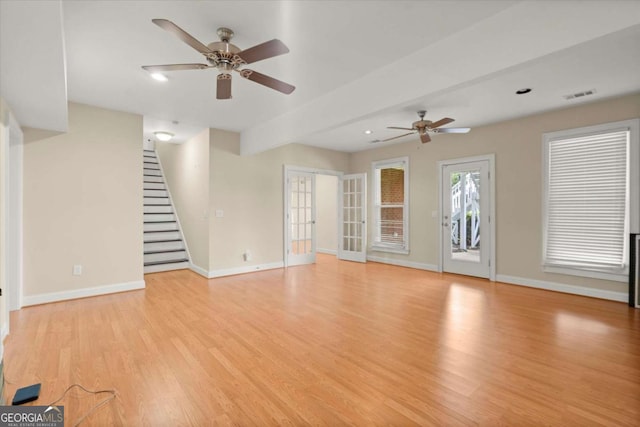 411 Hickory Fairway Ct, Woodstock, GA 30188 - unfurnished living room with ceiling fan, light wood-style flooring, stairway, french doors, and recessed lighting