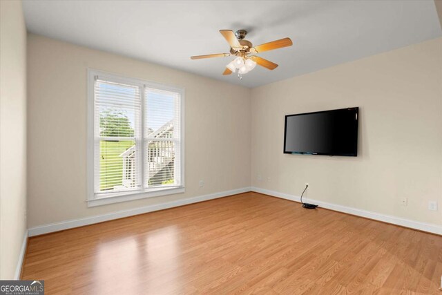 411 Hickory Fairway Ct, Woodstock, GA 30188 - spare room featuring light wood finished floors and a ceiling fan