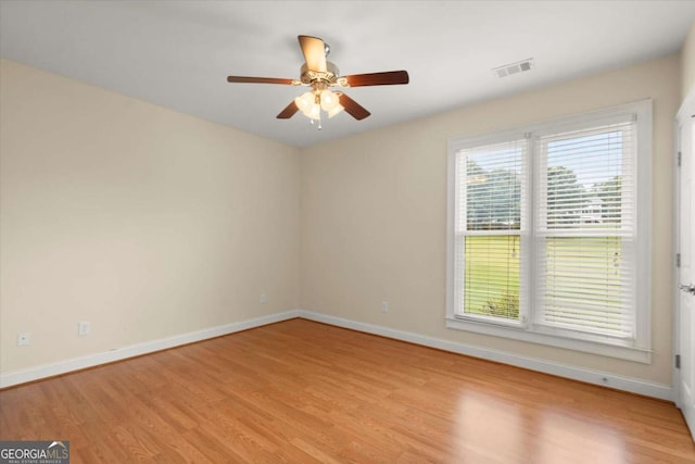 411 Hickory Fairway Ct, Woodstock, GA 30188 - empty room with light wood-type flooring and a ceiling fan