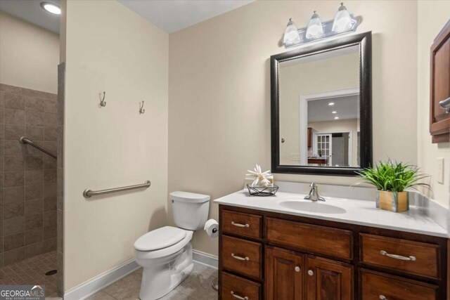 411 Hickory Fairway Ct, Woodstock, GA 30188 - bathroom featuring vanity, tiled shower, and tile patterned flooring