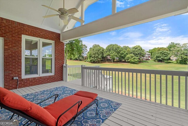 411 Hickory Fairway Ct, Woodstock, GA 30188 - wooden terrace with ceiling fan and a yard
