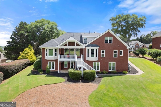 411 Hickory Fairway Ct, Woodstock, GA 30188 - view of front of house featuring brick siding, a front lawn, stairs, and a patio area