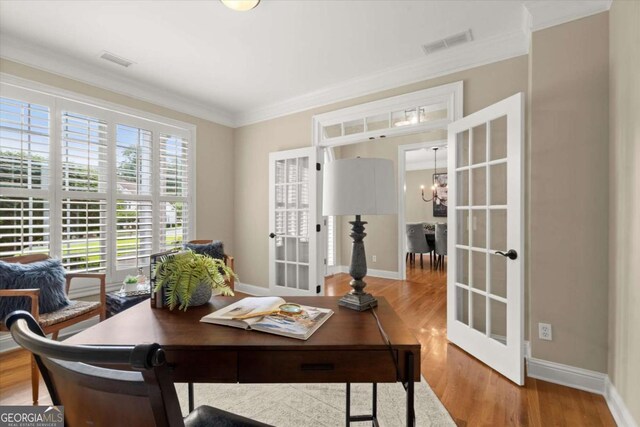 411 Hickory Fairway Ct, Woodstock, GA 30188 - home office featuring wood finished floors, a chandelier, crown molding, and french doors