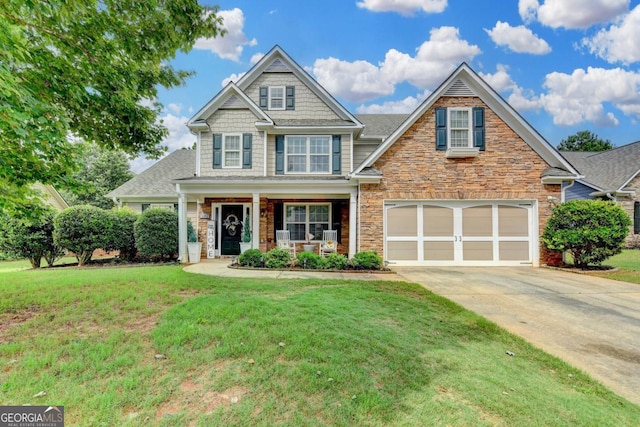 1811 Alberta Ln, Winder, GA 30680 - craftsman inspired home featuring driveway, a porch, stone siding, and a front lawn