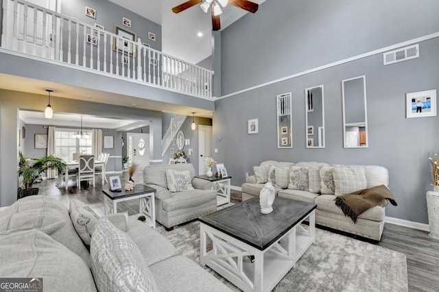 1811 Alberta Ln, Winder, GA 30680 - living area featuring wood finished floors, ceiling fan, and high vaulted ceiling