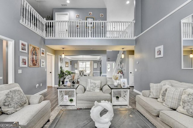 1811 Alberta Ln, Winder, GA 30680 - living room featuring wood finished floors and a high ceiling