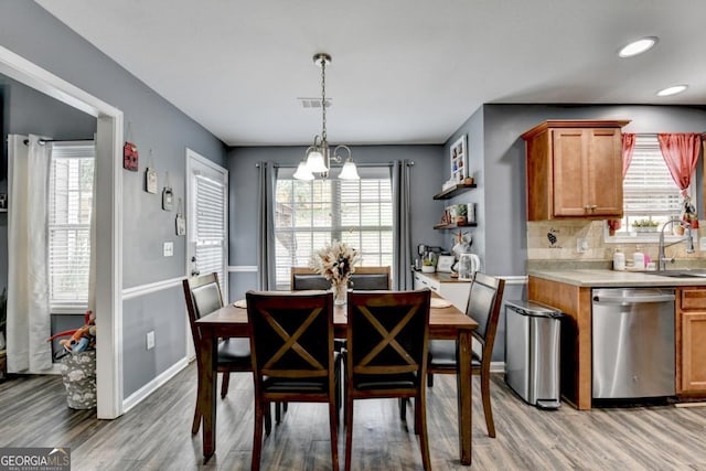 1811 Alberta Ln, Winder, GA 30680 - dining space with light wood-type flooring, plenty of natural light, recessed lighting, and a chandelier
