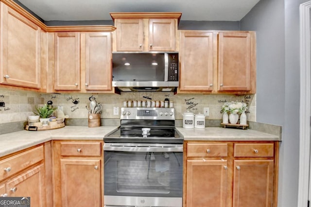 1811 Alberta Ln, Winder, GA 30680 - kitchen with stainless steel appliances, light countertops, and backsplash