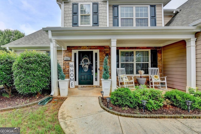 1811 Alberta Ln, Winder, GA 30680 - property entrance with a porch and a shingled roof