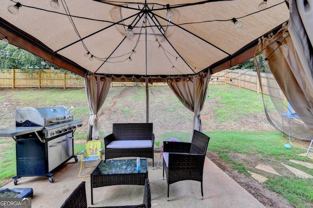 1811 Alberta Ln, Winder, GA 30680 - fenced backyard with a gazebo, outdoor lounge area, area for grilling, and a patio area