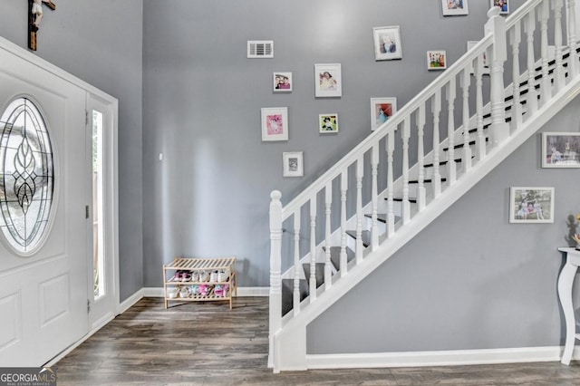 1811 Alberta Ln, Winder, GA 30680 - foyer featuring a high ceiling, wood finished floors, and stairs