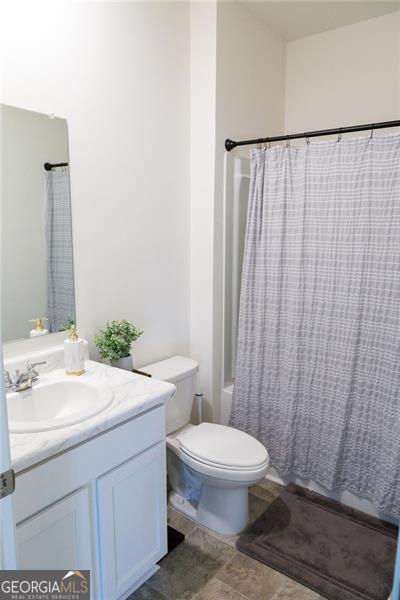 2159 Redfern, Dacula, GA 30019 - full bath featuring vanity and shower / bath combo with shower curtain