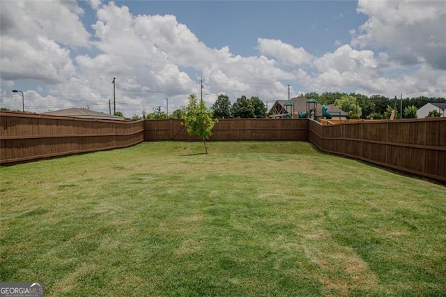 2159 Redfern, Dacula, GA 30019 - fenced backyard featuring a playground