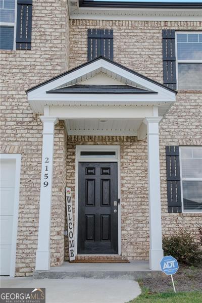 2159 Redfern, Dacula, GA 30019 - entrance to property featuring brick siding