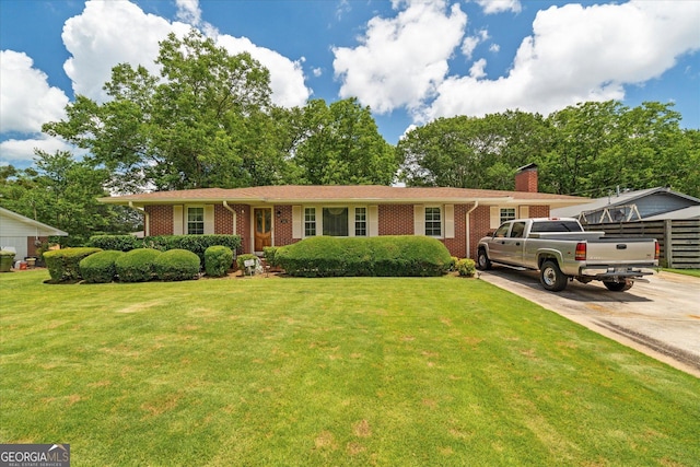 106 Lakeview Dr, Carrollton, GA 30117 - single story home featuring brick siding, concrete driveway, a front yard, and a chimney