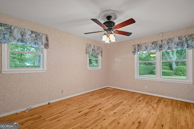 106 Lakeview Dr, Carrollton, GA 30117 - spare room featuring light wood-style floors, healthy amount of natural light, and a ceiling fan