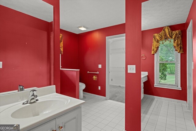 106 Lakeview Dr, Carrollton, GA 30117 - full bathroom featuring vanity, tile patterned flooring, and a spacious closet