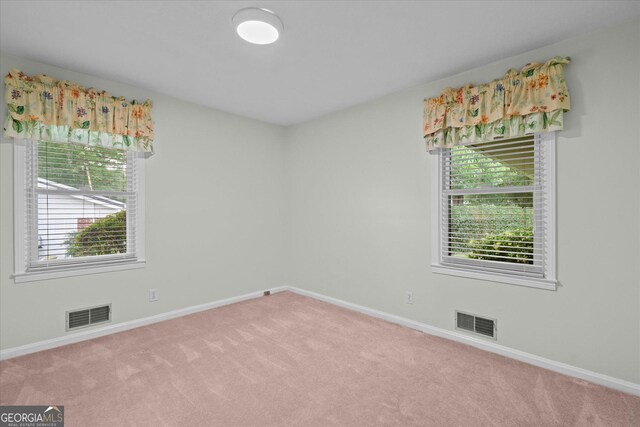106 Lakeview Dr, Carrollton, GA 30117 - carpeted empty room with plenty of natural light