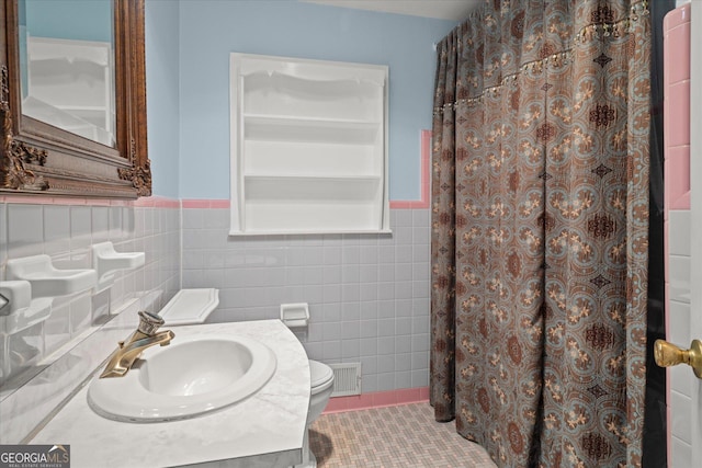 106 Lakeview Dr, Carrollton, GA 30117 - full bathroom with tile walls, a wainscoted wall, a shower with shower curtain, vanity, and tile patterned flooring