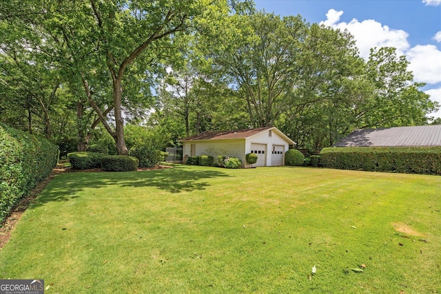 106 Lakeview Dr, Carrollton, GA 30117 - view of yard featuring a detached garage and an outbuilding