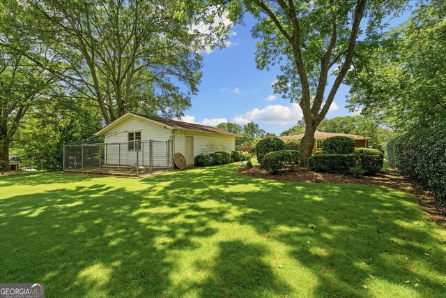 106 Lakeview Dr, Carrollton, GA 30117 - view of grassy yard featuring an outdoor structure