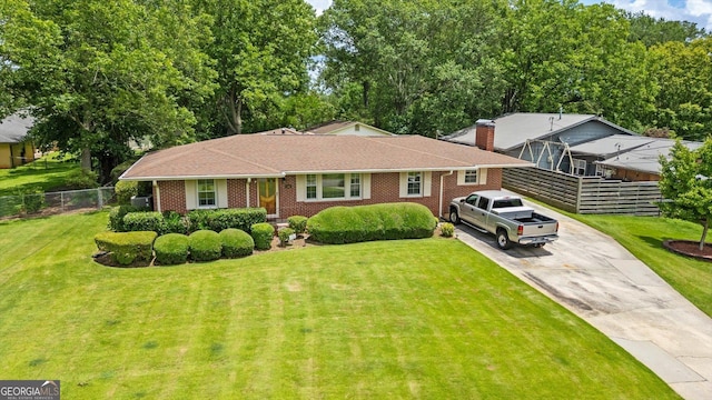 106 Lakeview Dr, Carrollton, GA 30117 - view of front of house featuring driveway, brick siding, and roof with shingles
