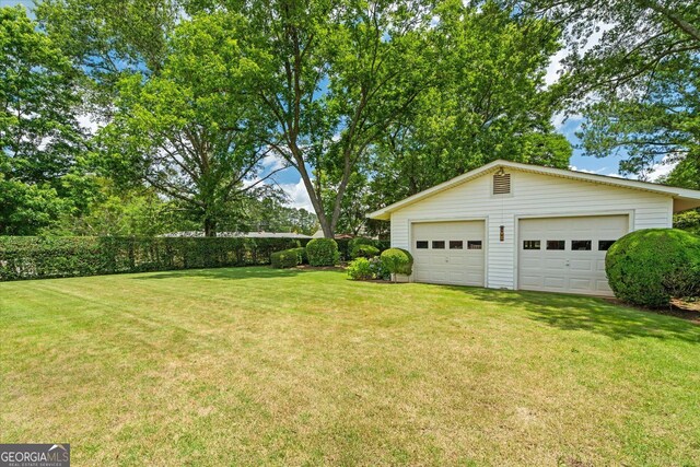 106 Lakeview Dr, Carrollton, GA 30117 - view of green lawn with an outbuilding and a detached garage