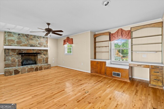 106 Lakeview Dr, Carrollton, GA 30117 - unfurnished living room featuring light wood finished floors, ceiling fan, crown molding, and a fireplace