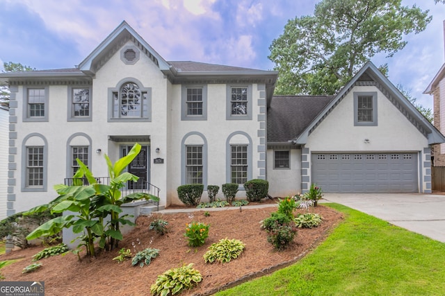 5674 Mountain Cres, Stone Mountain, GA 30087 - colonial-style house with driveway, stucco siding, and roof with shingles