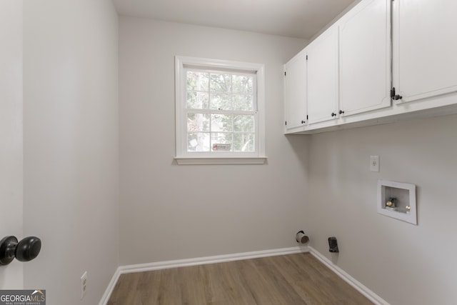5674 Mountain Cres, Stone Mountain, GA 30087 - laundry room with cabinet space, wood finished floors, and washer hookup